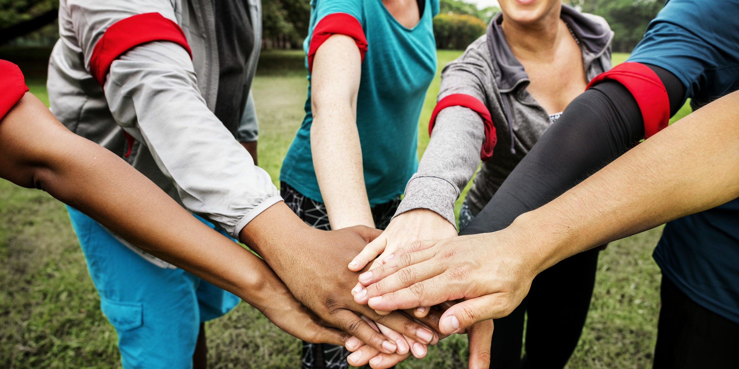 Diverse team stacking their hands